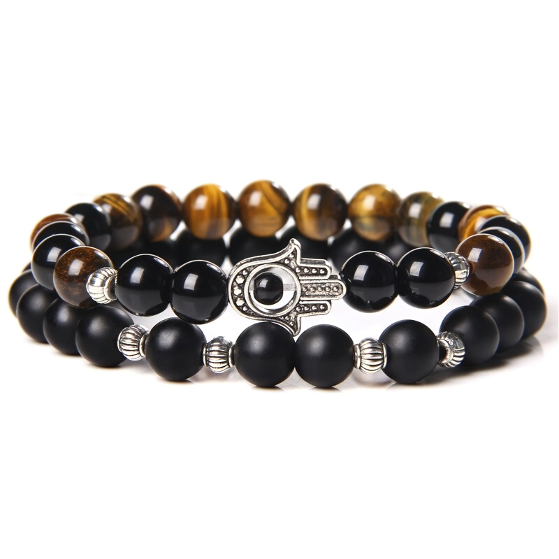Stylish unisex onyx stone bracelet featuring beaded design and silver metal insert, perfect casual accessory.