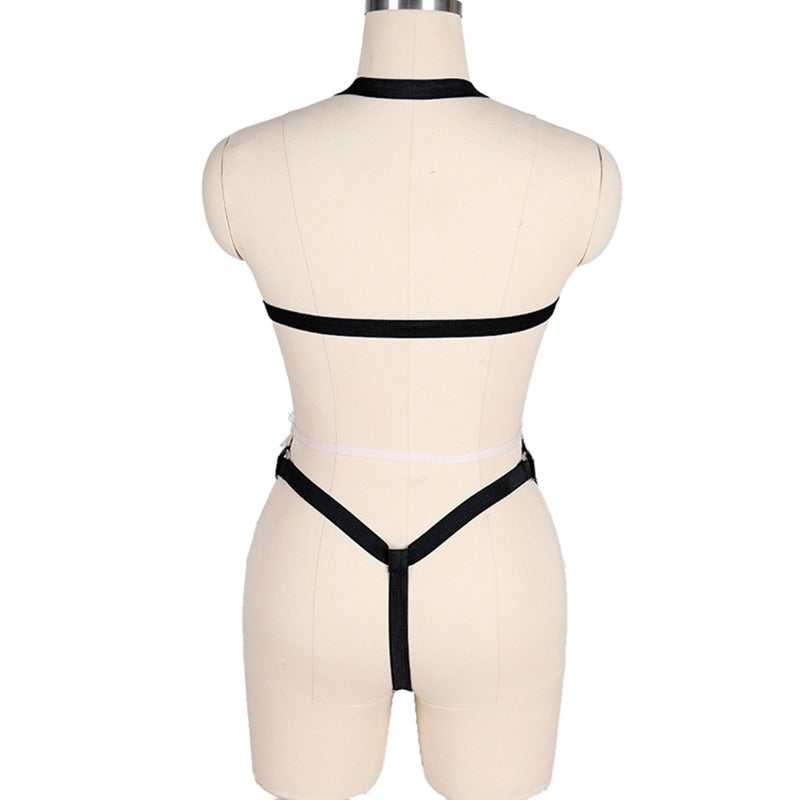 Back view of women's gothic bodysuit harness with open buttocks, featuring sleek straps and a unique design.