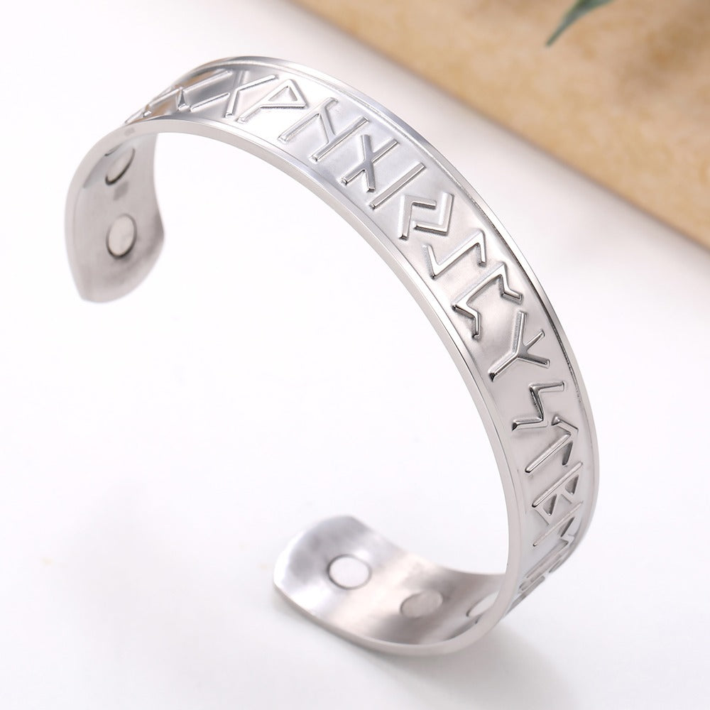 Open cuff magnetic therapy bracelet with Nordic runes, made of stainless steel for a vintage unisex look.