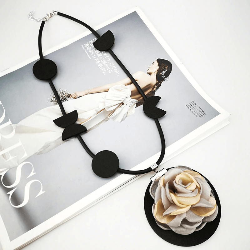 Handmade Boho flower pendant necklace, featuring black rubber circles and a floral centerpiece, perfect for gothic women's accessories.
