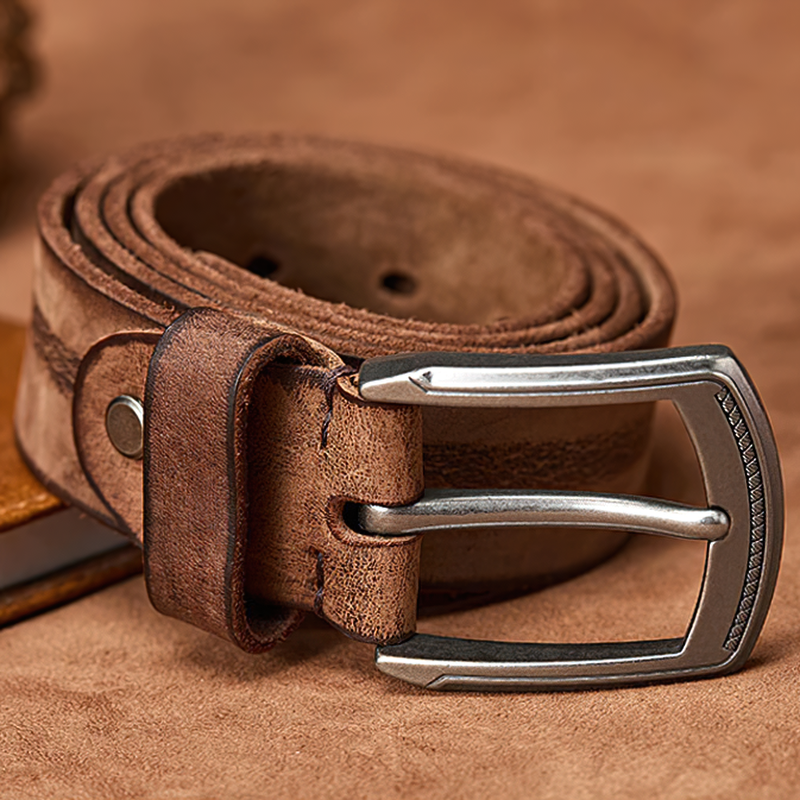 Stylish original cowhide belt with alloy buckle, perfect for casual outfits and jeans, in a rich brown color.
