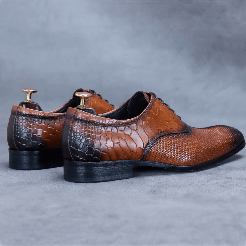 Stylish men's luxury leather Oxford shoes with unique textured design in brown and black.