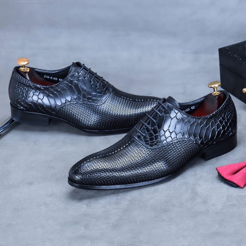 Stylish black leather Oxford shoes with unique textured design, perfect for casual or formal outfits.