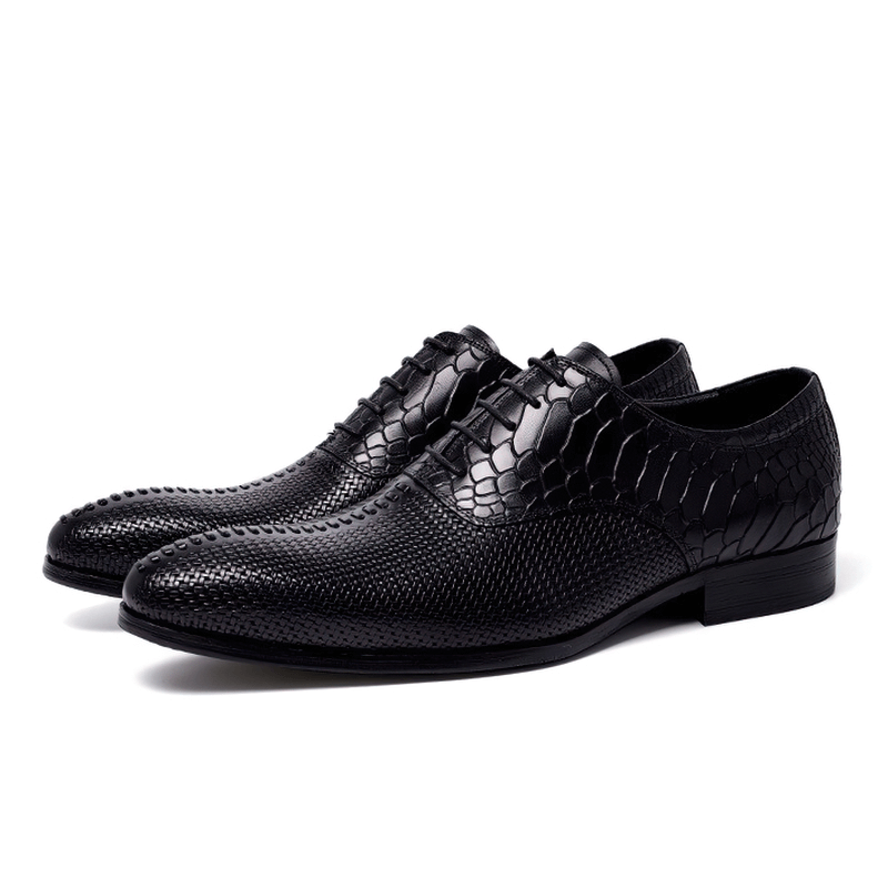 Stylish men's lace-up black leather Oxford shoes with unique textured design, perfect for casual or formal wear.