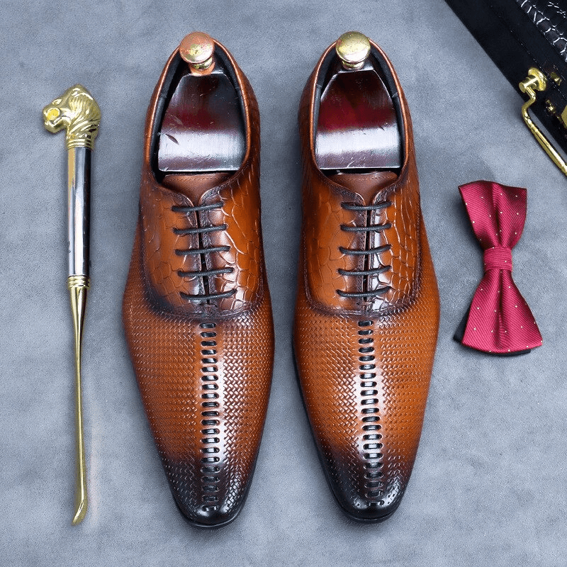 Stylish men's luxury lace-up leather Oxford shoes with unique design, perfect for a fashionable wardrobe.