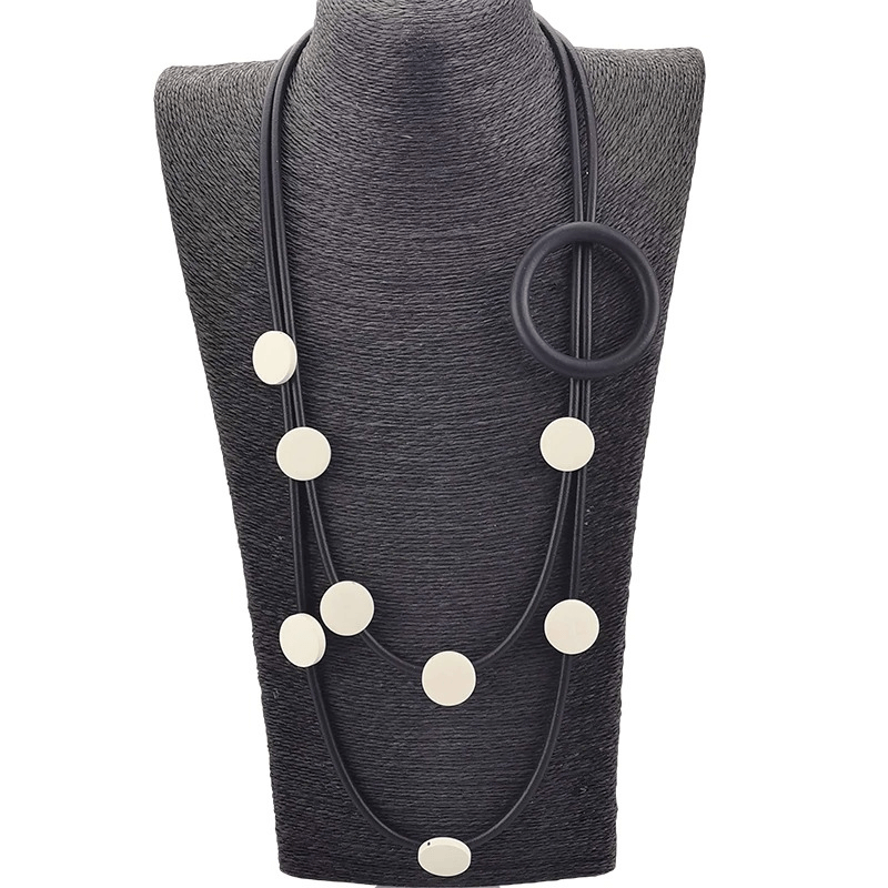 Stylish women’s gothic rubber necklace featuring circular and oval accents in an ethnic design.