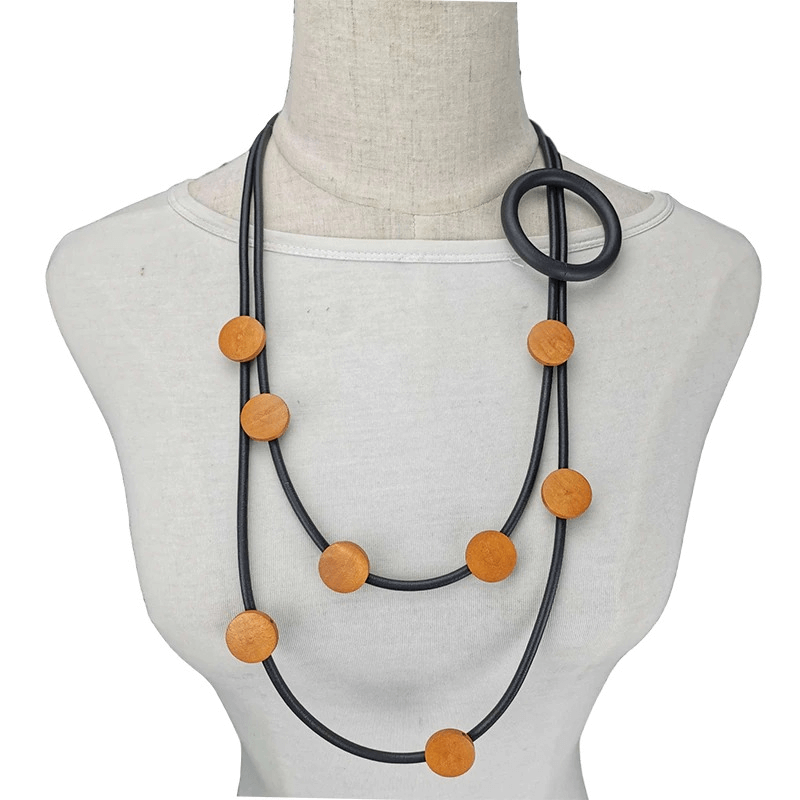 Stylish women's gothic rubber necklace featuring wooden beads and an ethnic design, perfect for elevating any outfit.