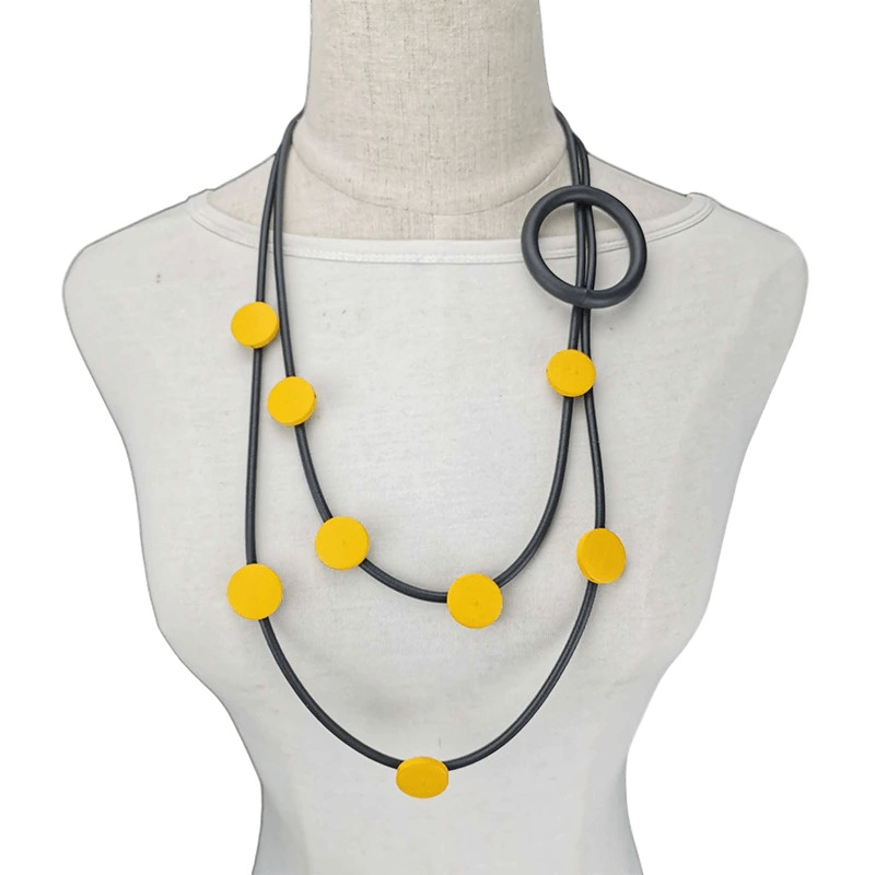 Gothic style women's rubber necklace with yellow accents and modern design for ethnic accessories.