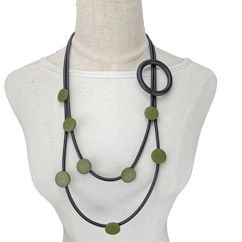 Stylish women's gothic rubber necklace with green beads, perfect ethnic accessory for unique outfits.