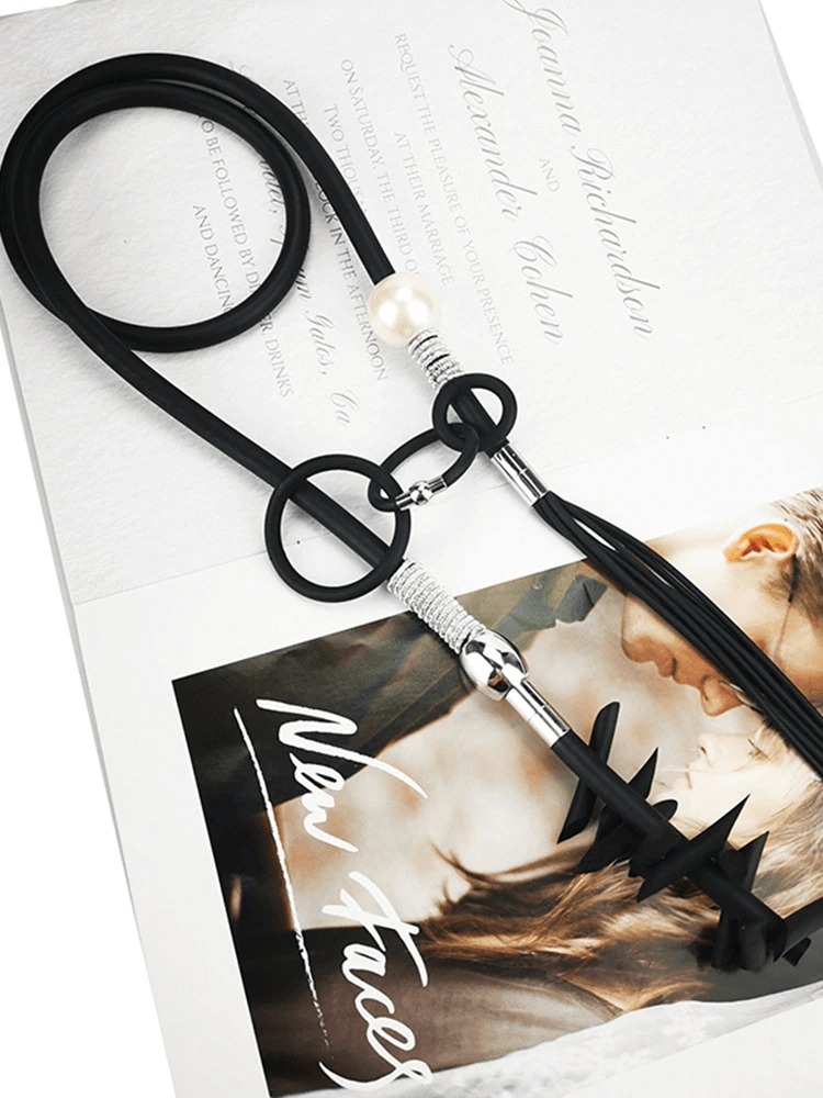 Original design women's vintage punk necklace featuring removable details, black cord and pearl accents.