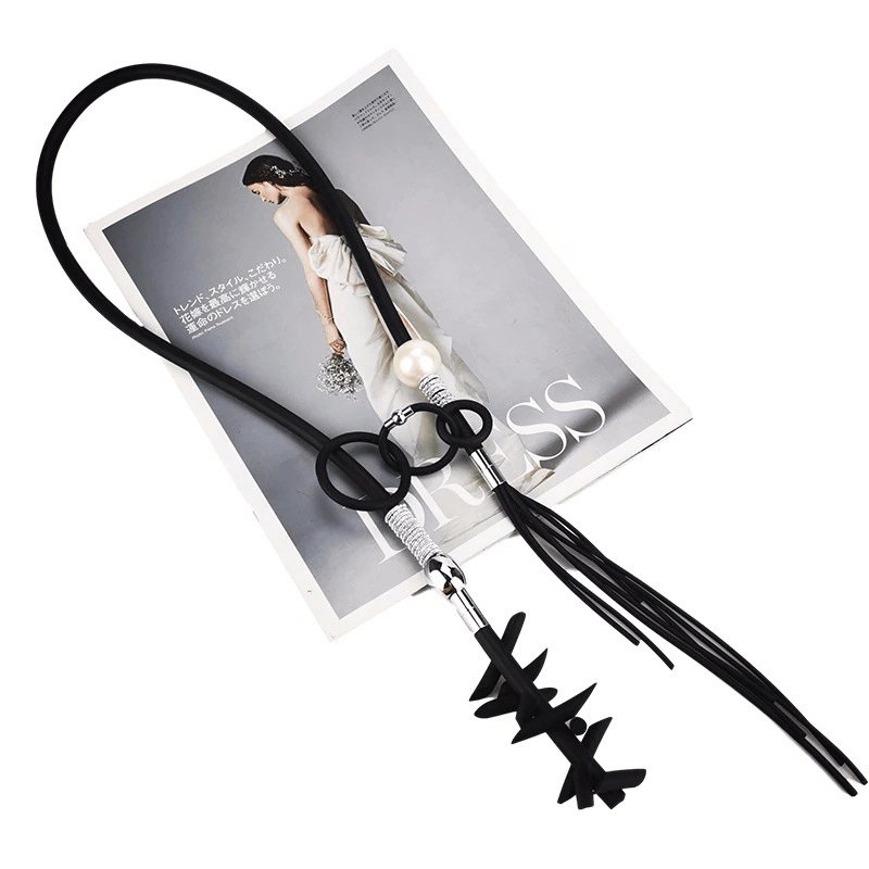 Stylish women's vintage punk necklace with removable details, featuring black cord and pearl accent.