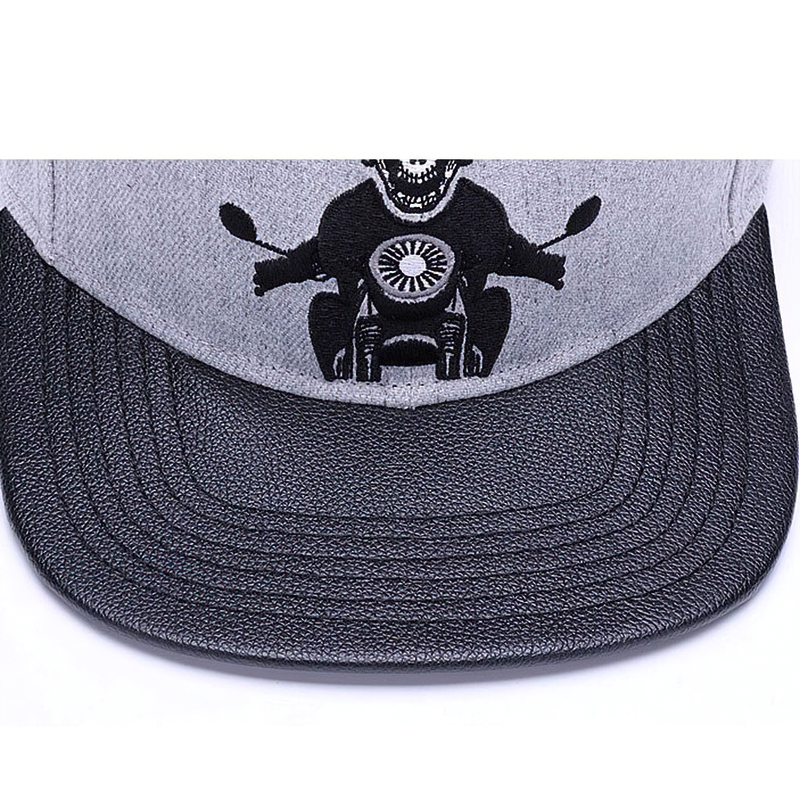 Gray unisex baseball cap featuring embroidered skeleton riding a motorcycle for a punk rock vibe.