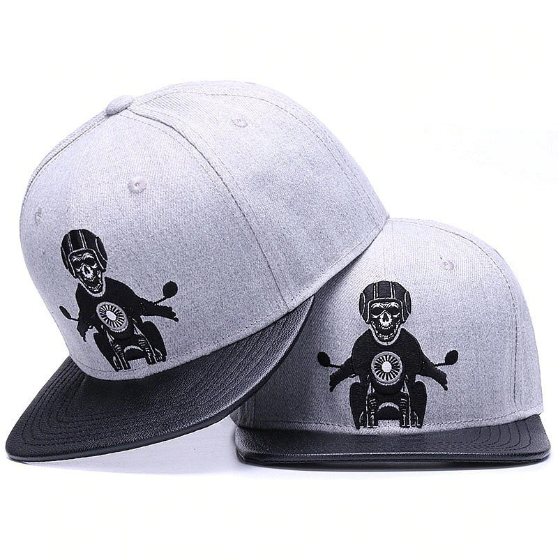 Gray unisex baseball caps with embroidered skeleton riding a motorcycle, perfect for punk rock style outfits.