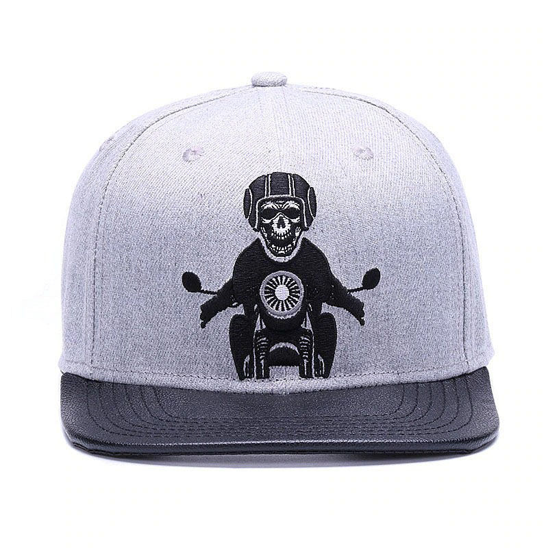 Gray unisex snapback baseball cap featuring an embroidered skeleton riding a motorcycle for a punk rock look.