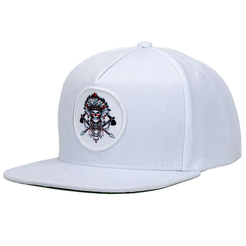 Original snapback baseball cap in white featuring an embroidered tribal skeleton design, adjustable for unisex wear.