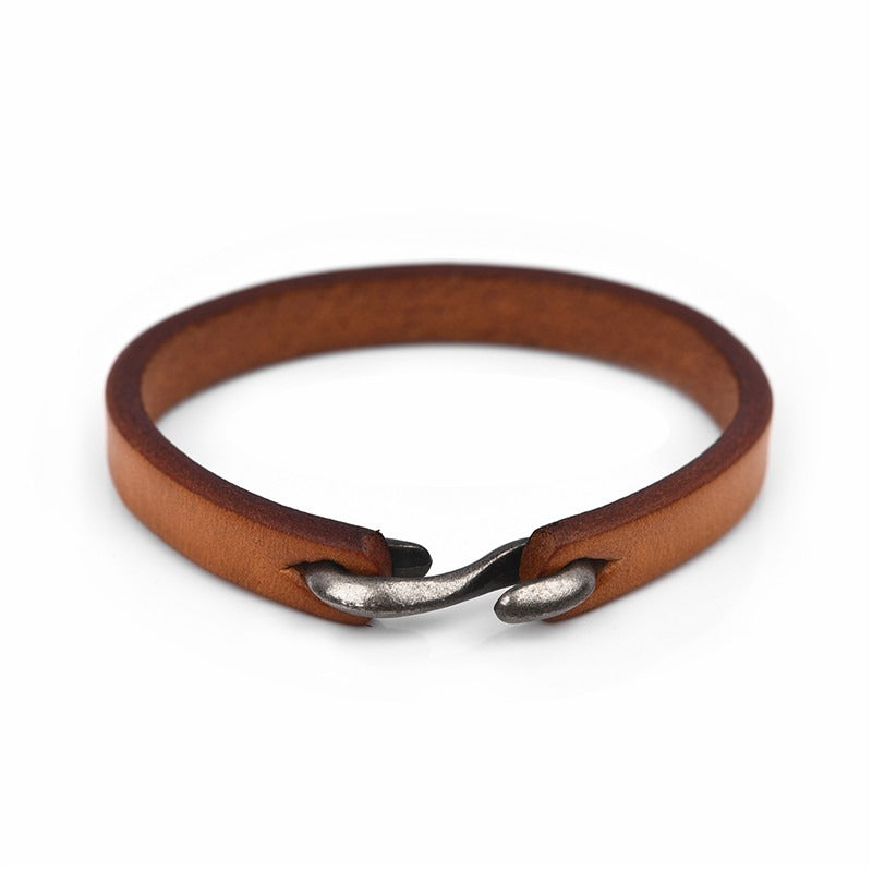 Vintage brown genuine leather bracelet for men and women, featuring a unique clasp style, perfect for grunge outfits.