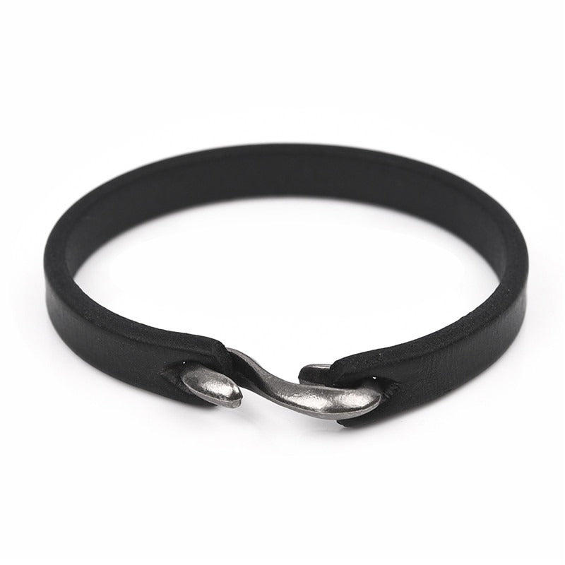 Minimalistic vintage black leather bracelet with unique clasp, perfect for grunge style outfits.