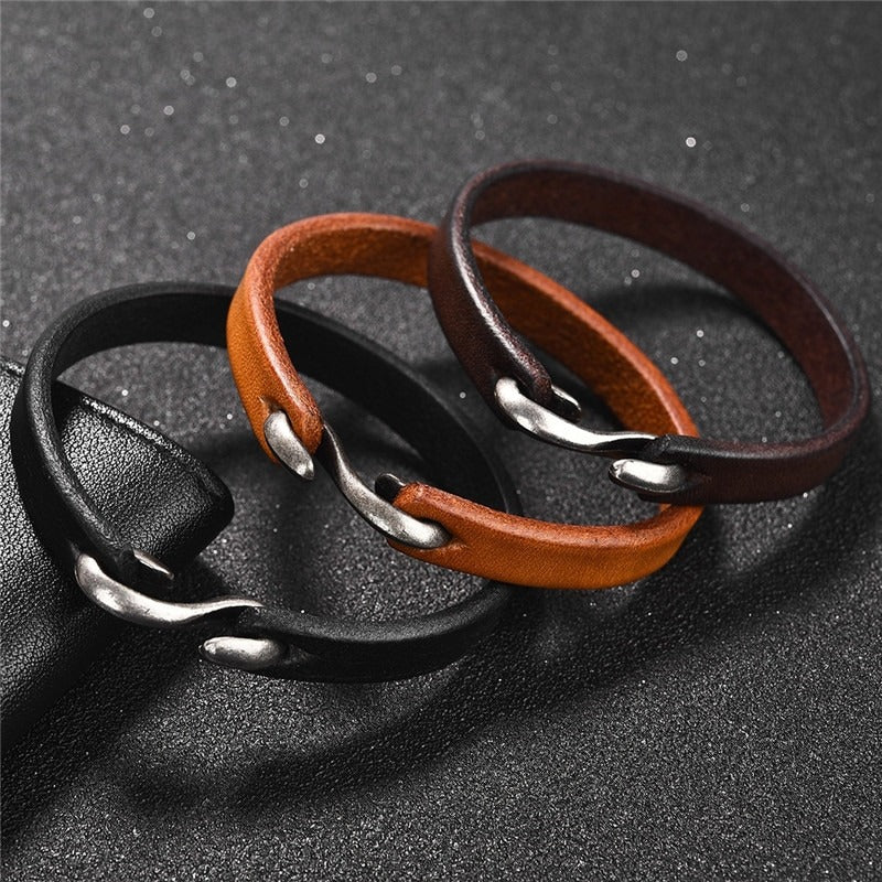 Original vintage black and brown leather bracelets for men and women, showcasing minimalist grunge style with metal clasps.