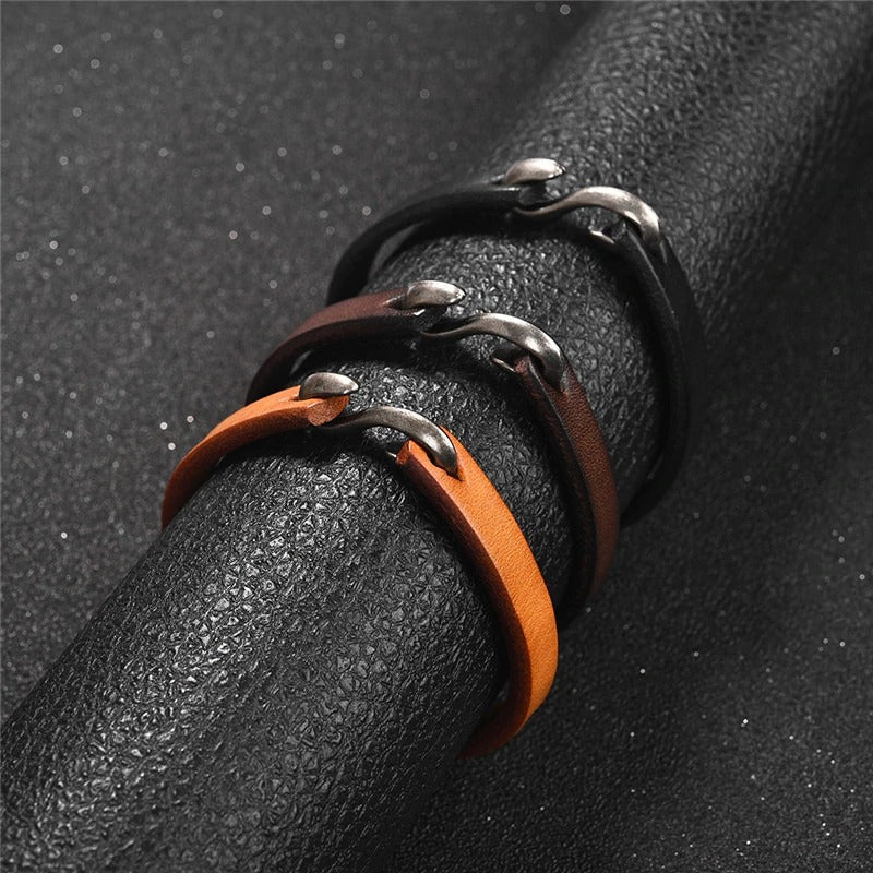 Original style vintage leather bracelets in black, brown, and orange with stylish metal clasps.