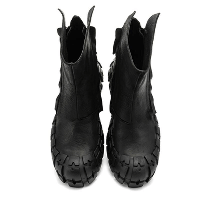 Stylish original thick-soled black ankle boots with side zippers for a punk motorcycle look.