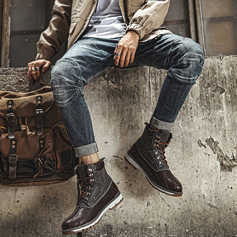 Stylish outdoor waterproof men's motorcycle boots paired with casual jeans and a trendy jacket, perfect for winter adventures.
