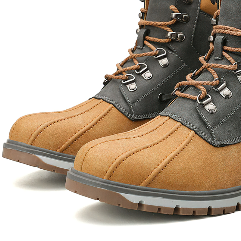 Close-up of outdoor waterproof men's motorcycle boots in brown and gray, featuring modern design and durable materials.