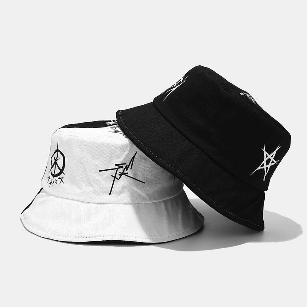 Patchwork graffiti cotton bucket hats for men and women in black and white, stylish casual travel accessories.