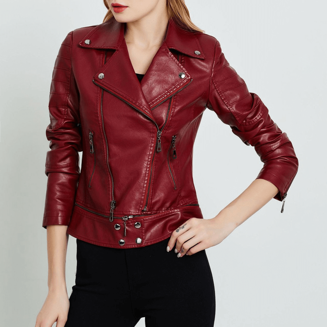 Stylish women's red patchwork PU leather motorcycle jacket with zippers and trendy design.