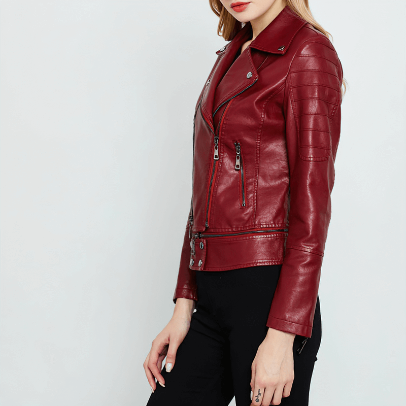 Stylish women's patchwork PU leather motorcycle jacket in red with detailed zipper and side pockets.