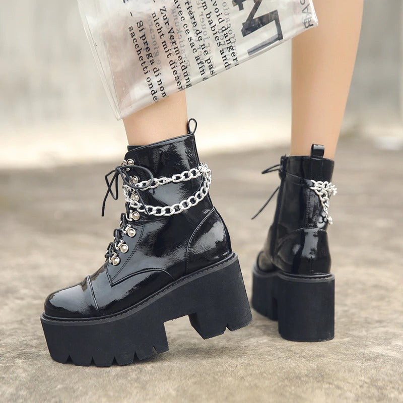 Gothic women's black platform boots with ankle zipper and double chain detail, perfect for edgy style in any season.
