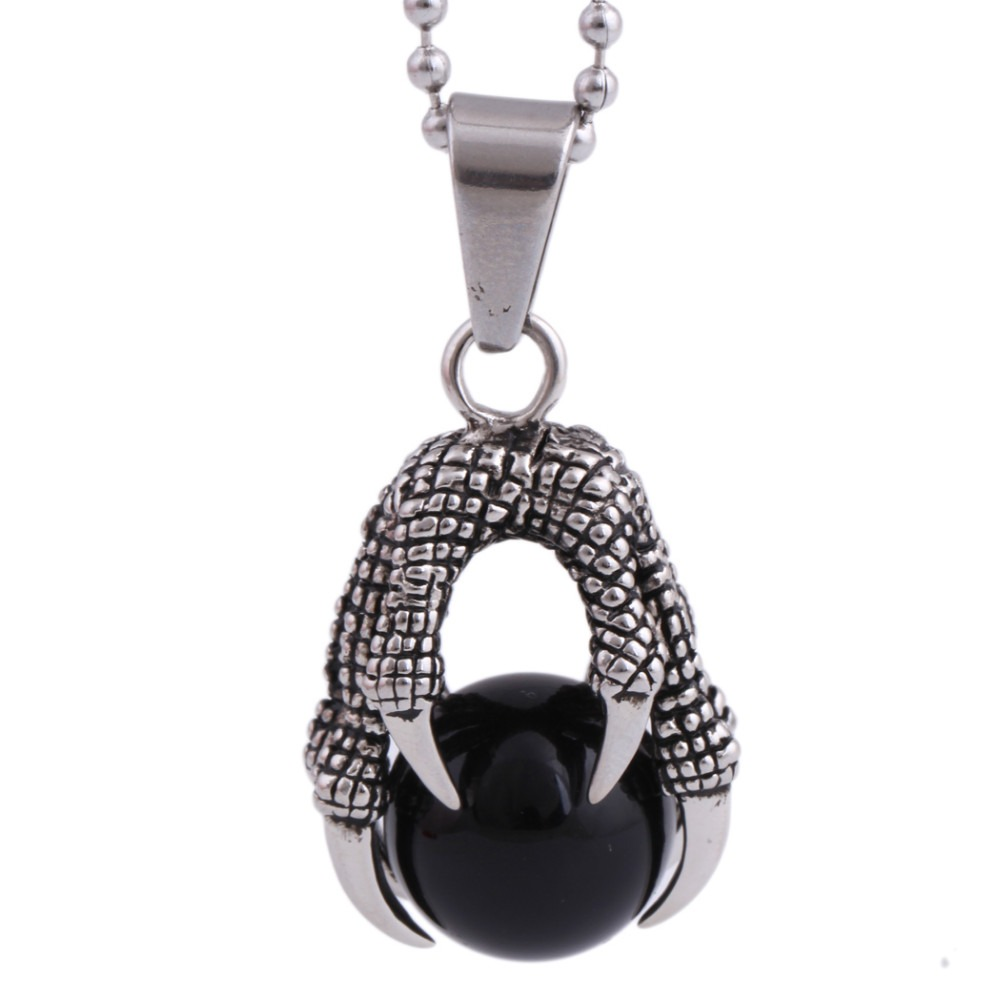 Stainless steel pendant featuring a dramatic dragon's claw clutching a big black crystal stone.