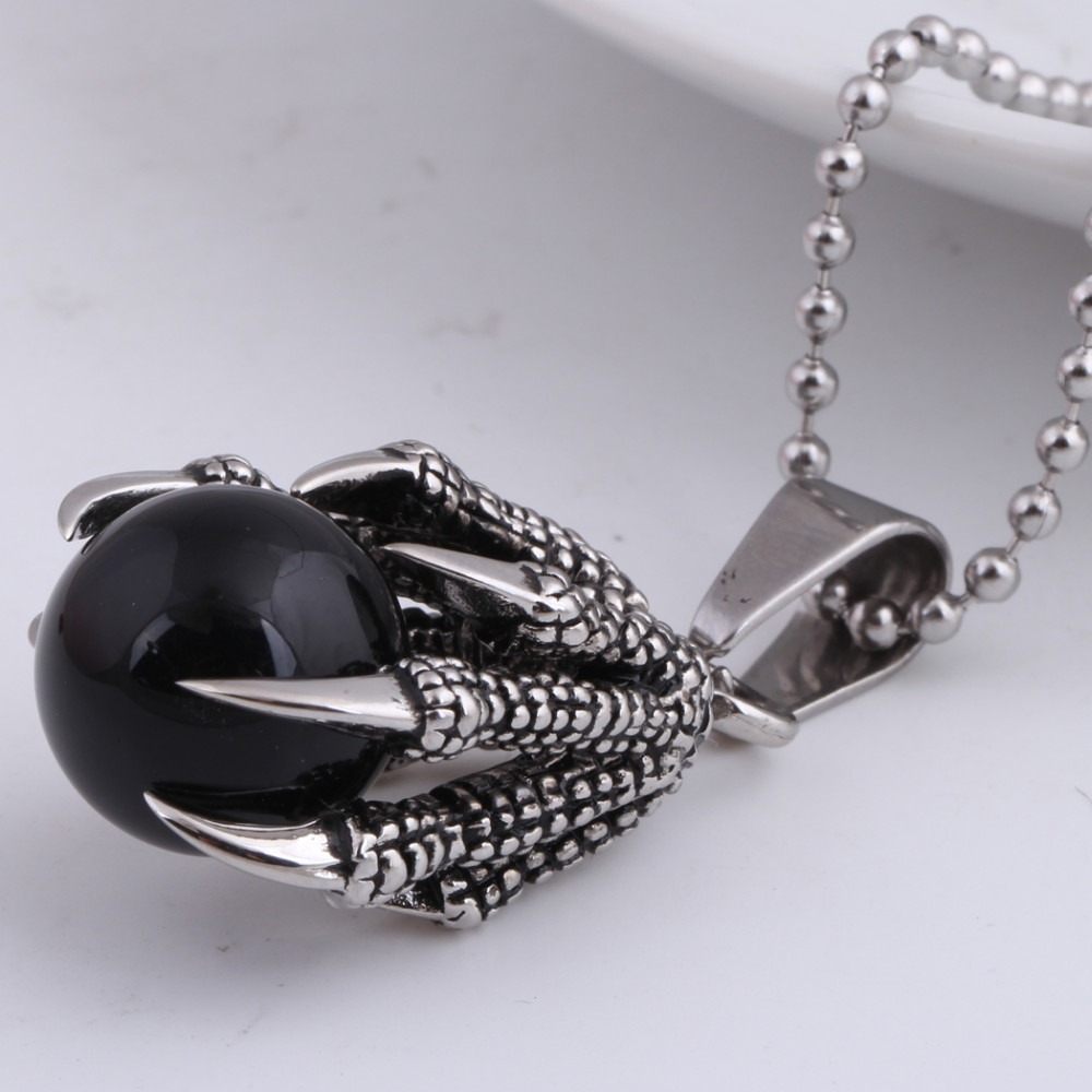 Stainless steel dragon's claw pendant with big black stone crystal, perfect for men and women, ideal for layering.