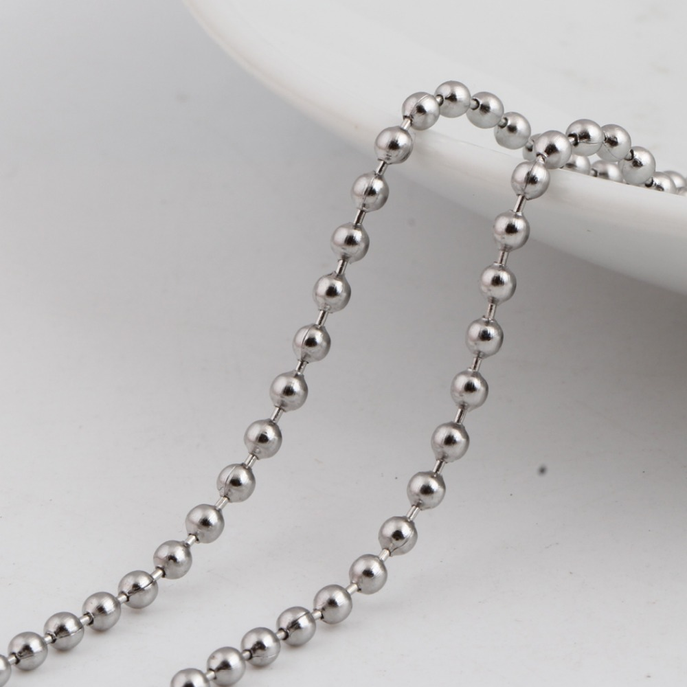 Close-up of a shiny stainless steel bead chain, perfect for layering with pendants and necklaces.