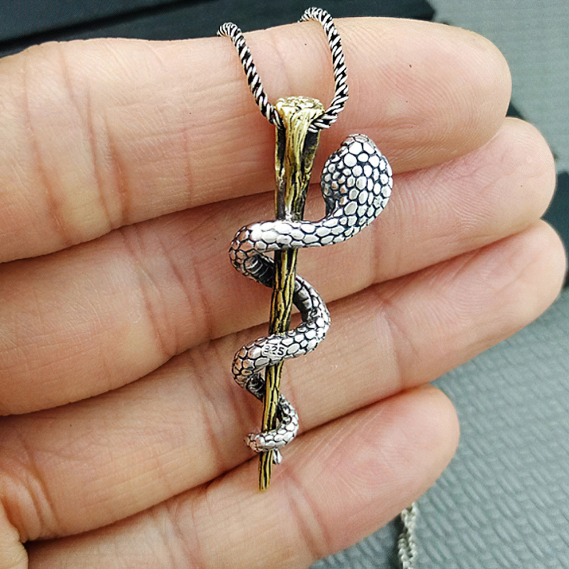 S925 sterling silver cobra pendant on a stick, showcasing intricate details and alternative jewelry style.