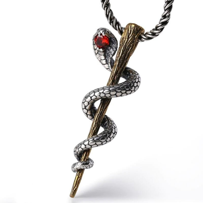 Stylish cobra pendant in S925 sterling silver with intricate details and a red gemstone accent.