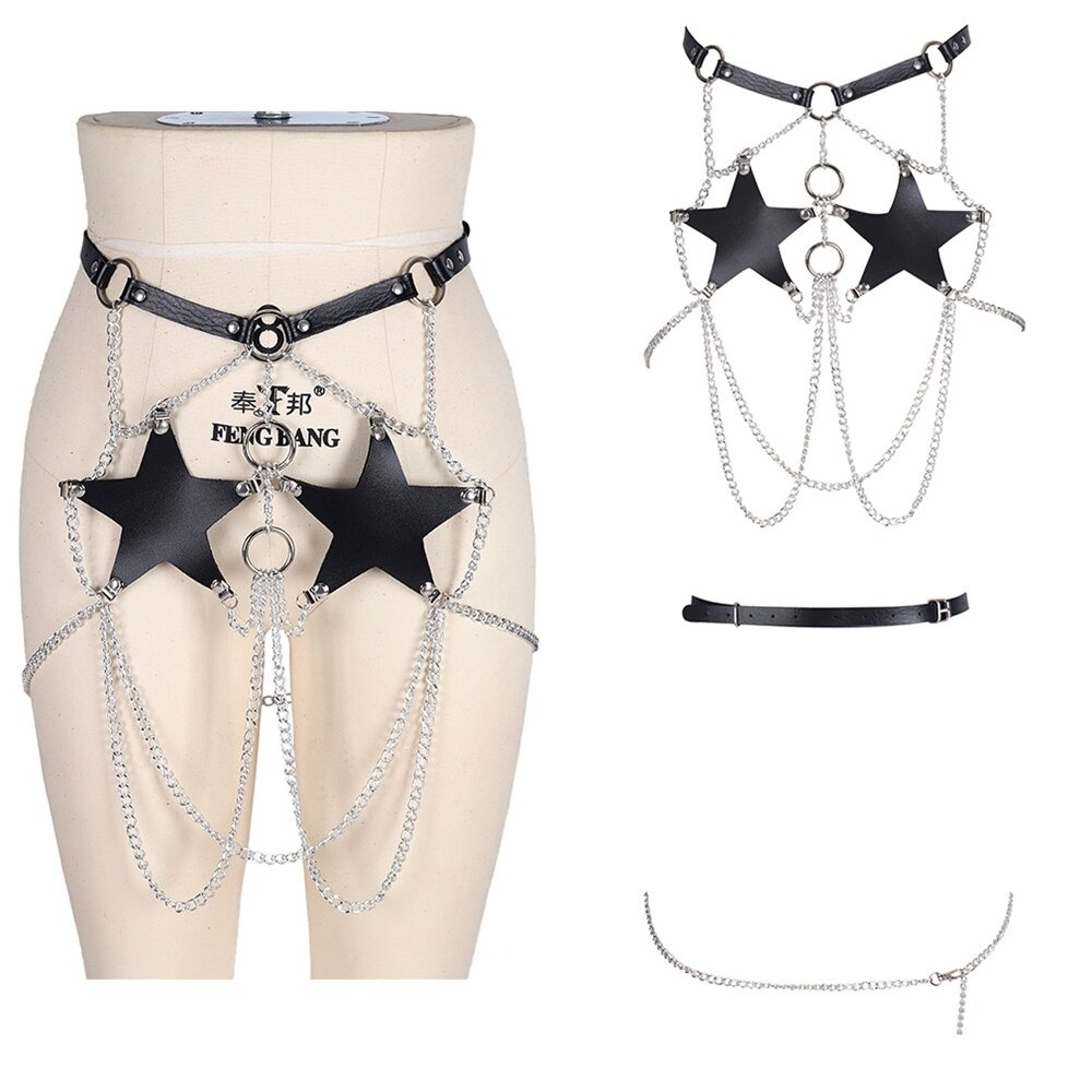 Gothic women’s PU leather harness with star inserts and silver chain belt, perfect for a sexy statement look.