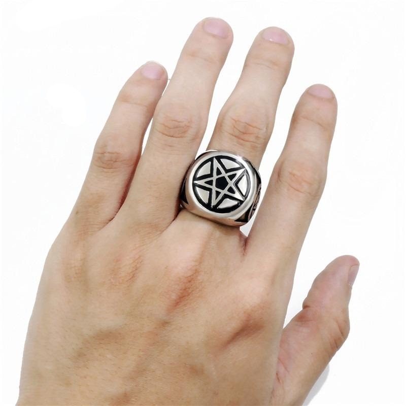 Pentagram star ring on hand, alternative jewelry for punk style, perfect for rock concerts and massive accessories.
