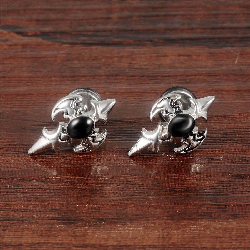 Stylish cross design stud earrings in stainless steel with black gemstone, perfect for alternative fashion lovers.