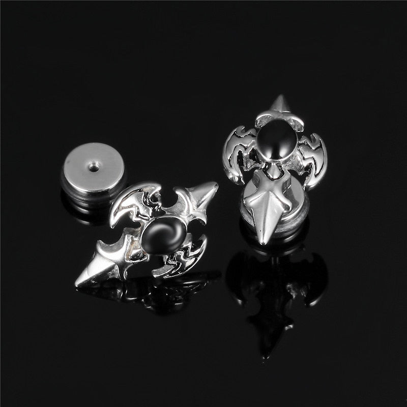 Stylish stainless steel cross design stud earrings featuring a spike look, perfect for alternative fashion lovers.
