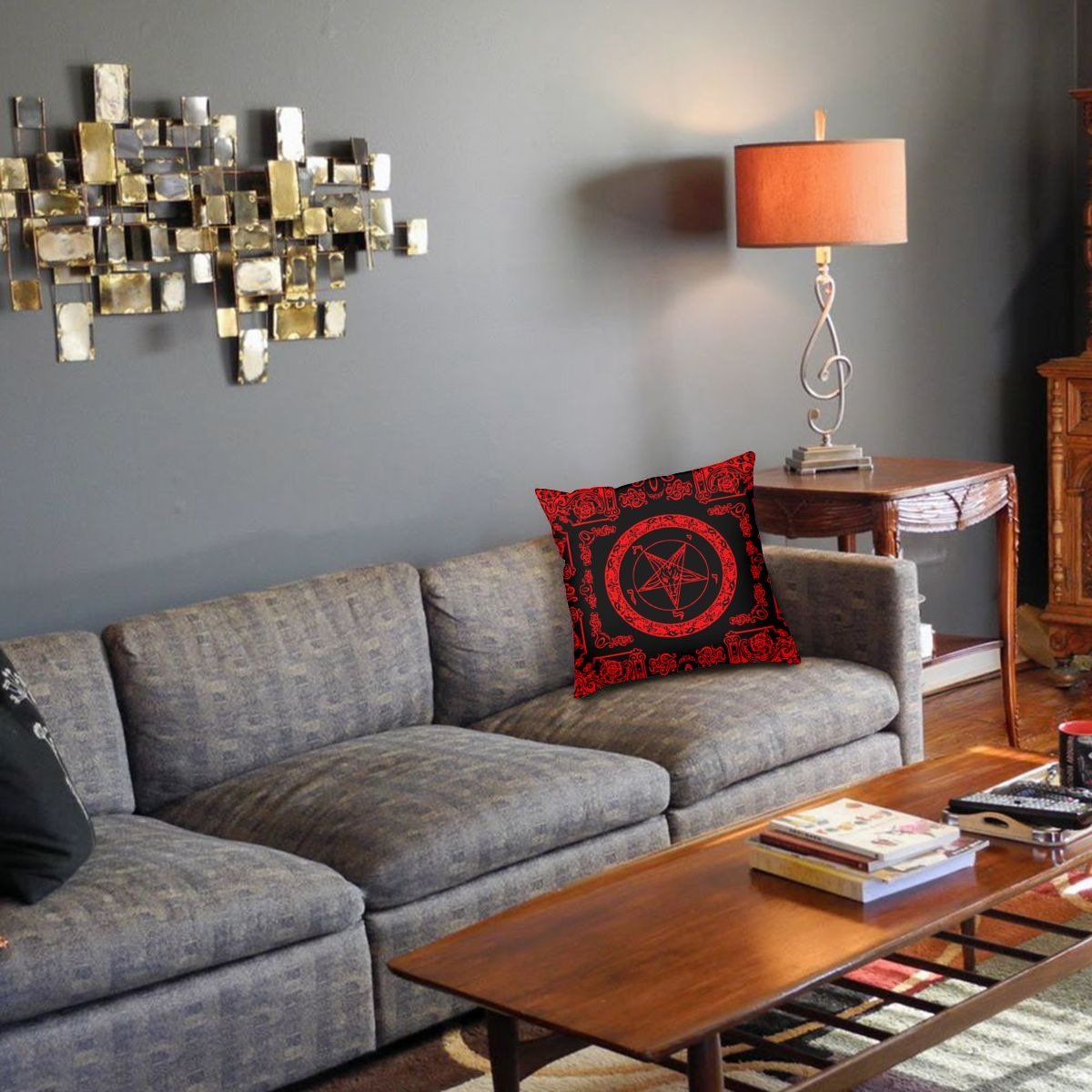 Gothic double-sided pillowcase with satanic signs on a cozy couch in a stylish living room.