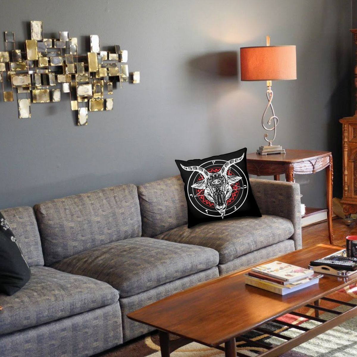 Satanic goat print pillow cover on a sofa in a stylish gothic living room decoration.