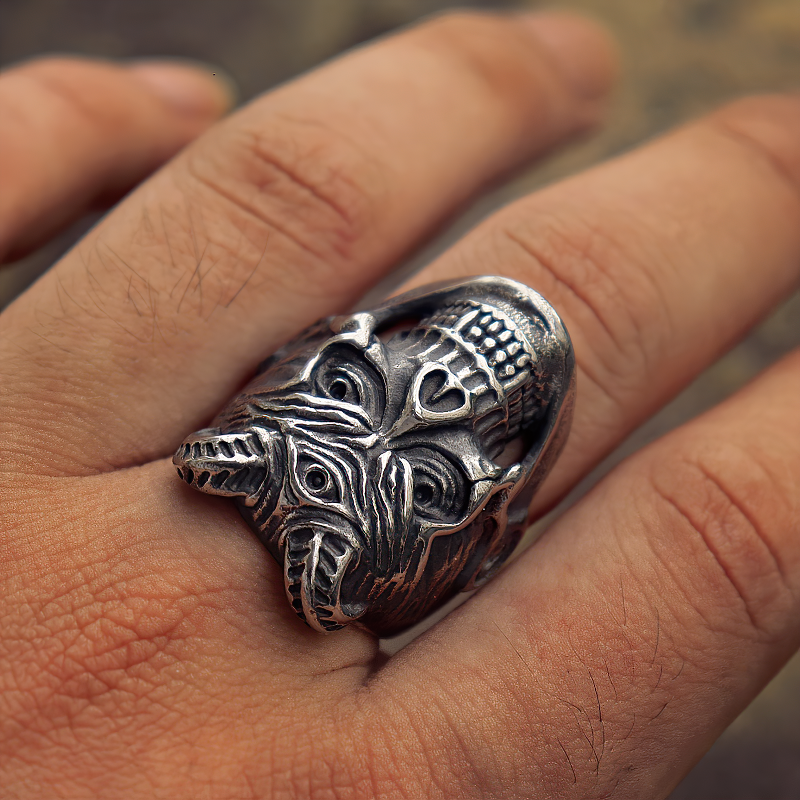 Stainless steel devil skull ring with three eyes, perfect for biker and goth fashion, showcased on a hand.