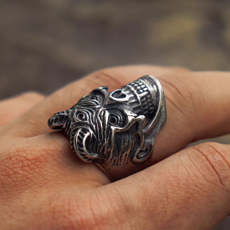 Devil skull ring worn on finger, featuring a three-eyed demon design in stainless steel, perfect for goth and biker styles.