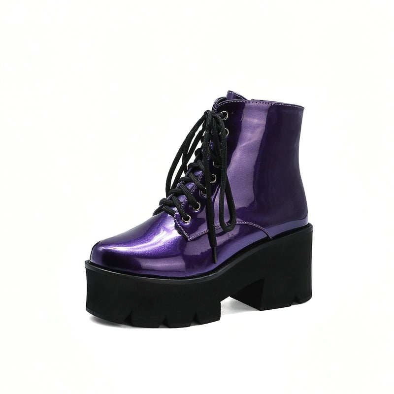 Purple platform ankle boots with round toe and zipper, featuring lace-up style and thick black outsole.