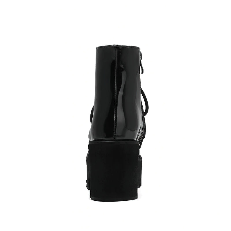 Back view of women's black platform ankle boots with round toe and zipper, stylish and designed for winter fashion.