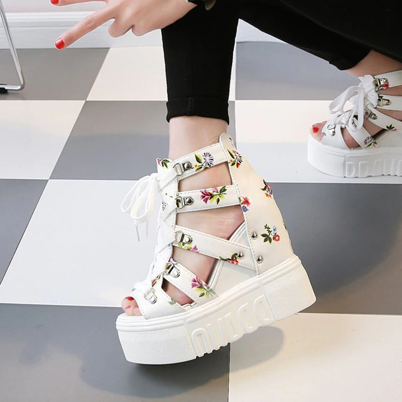 Stylish platform women sandals with floral print, showcasing ankle straps and chunky heels, perfect for summer looks.