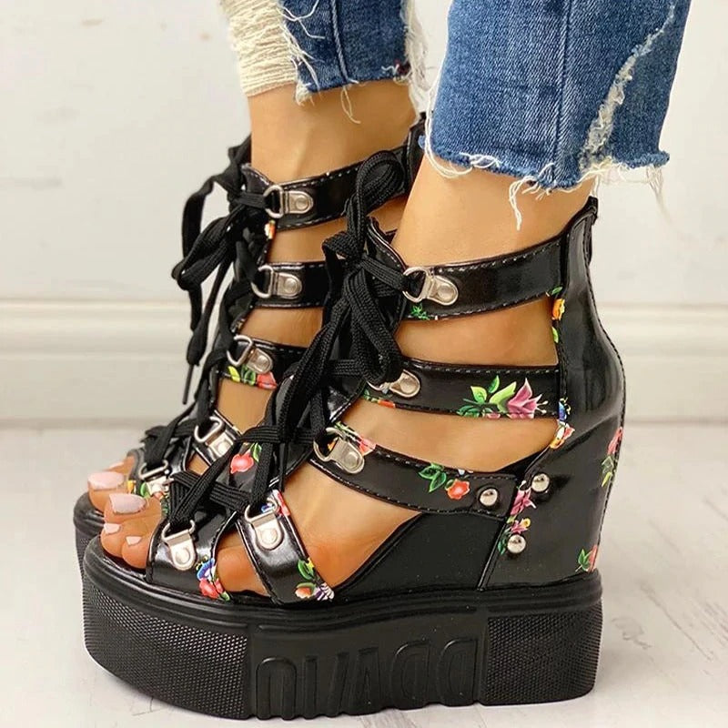 Stylish platform women sandals with floral print, high heel, and chunky sole, perfect for summer outfits.