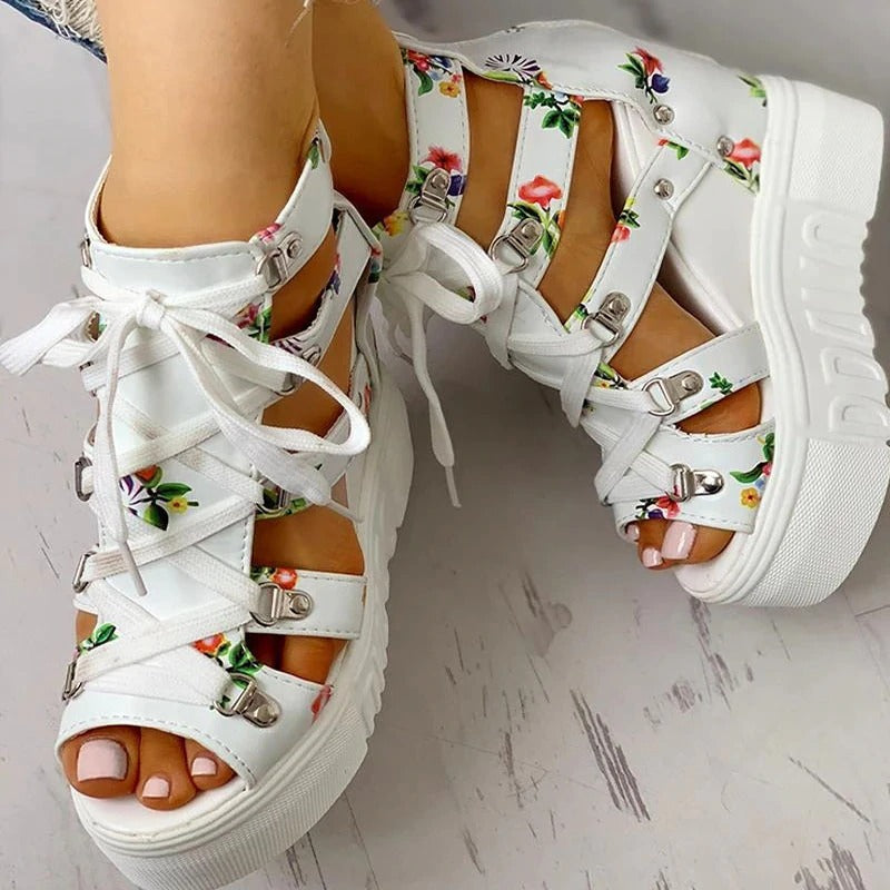 Stylish platform women sandals with floral print and ankle straps, perfect for summer outfits.