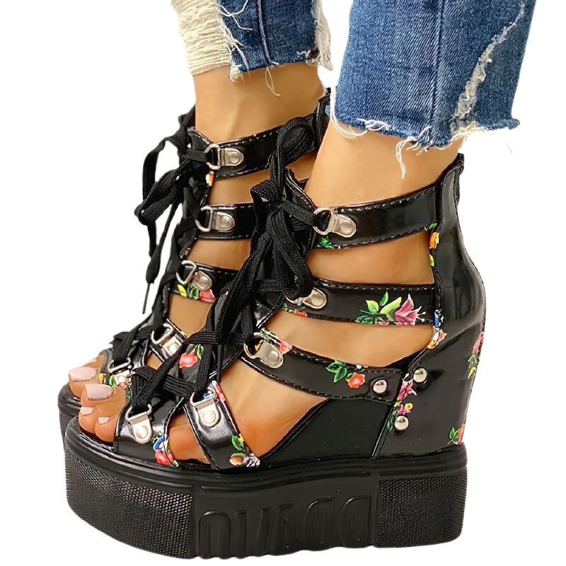 Stylish black platform sandals with floral print, high heel, and buckle straps, perfect for summer outfits.