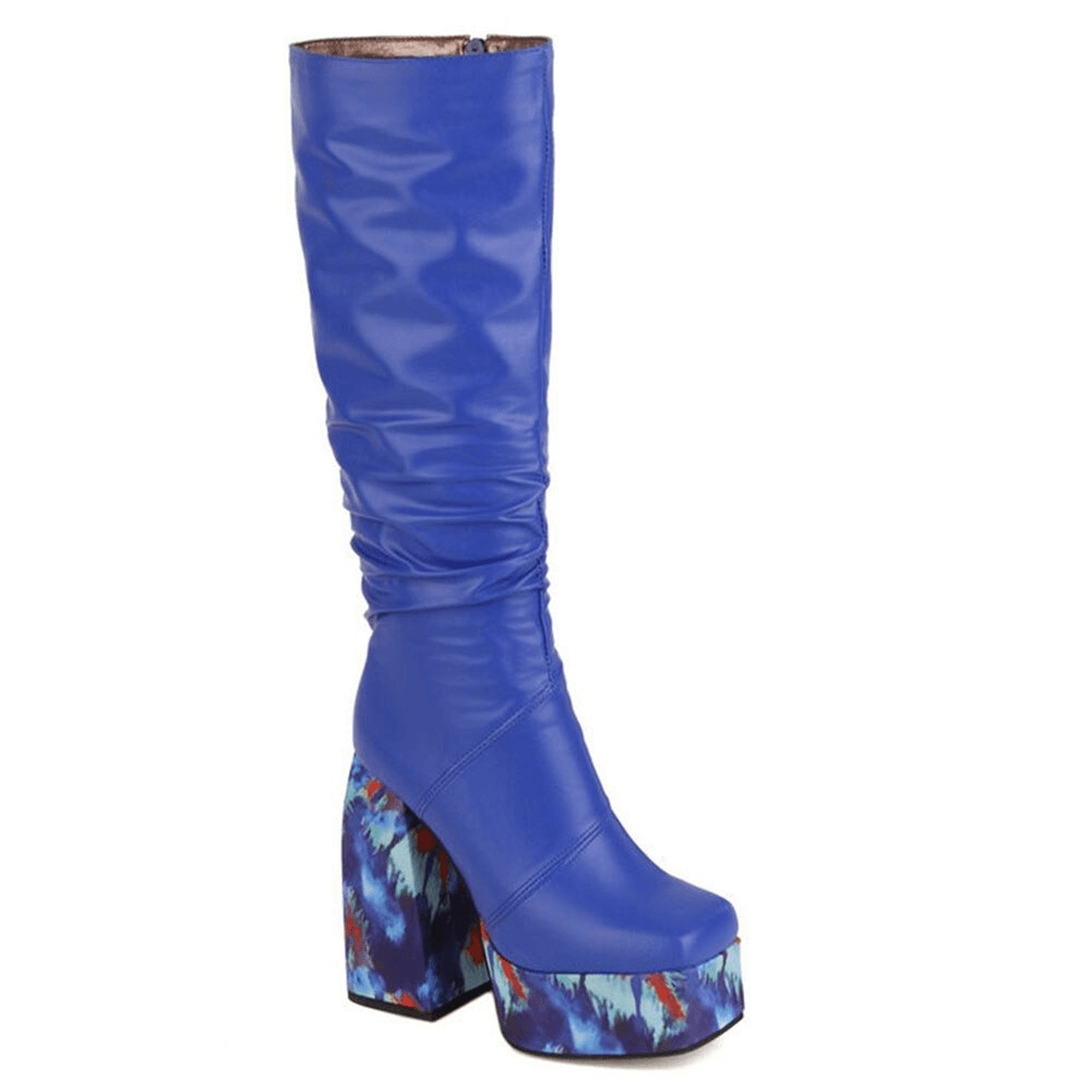 Blue platform knee-high boots with vibrant patterned heels, perfect for a trendy casual look and stylish comfort.
